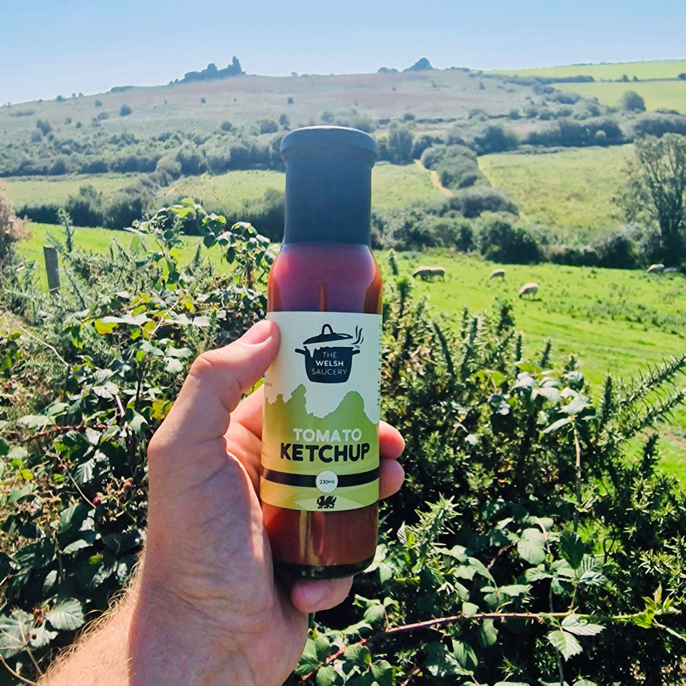 Steve holding a fresh bottle of Tomato Ketchup on a sunny day in South Wales